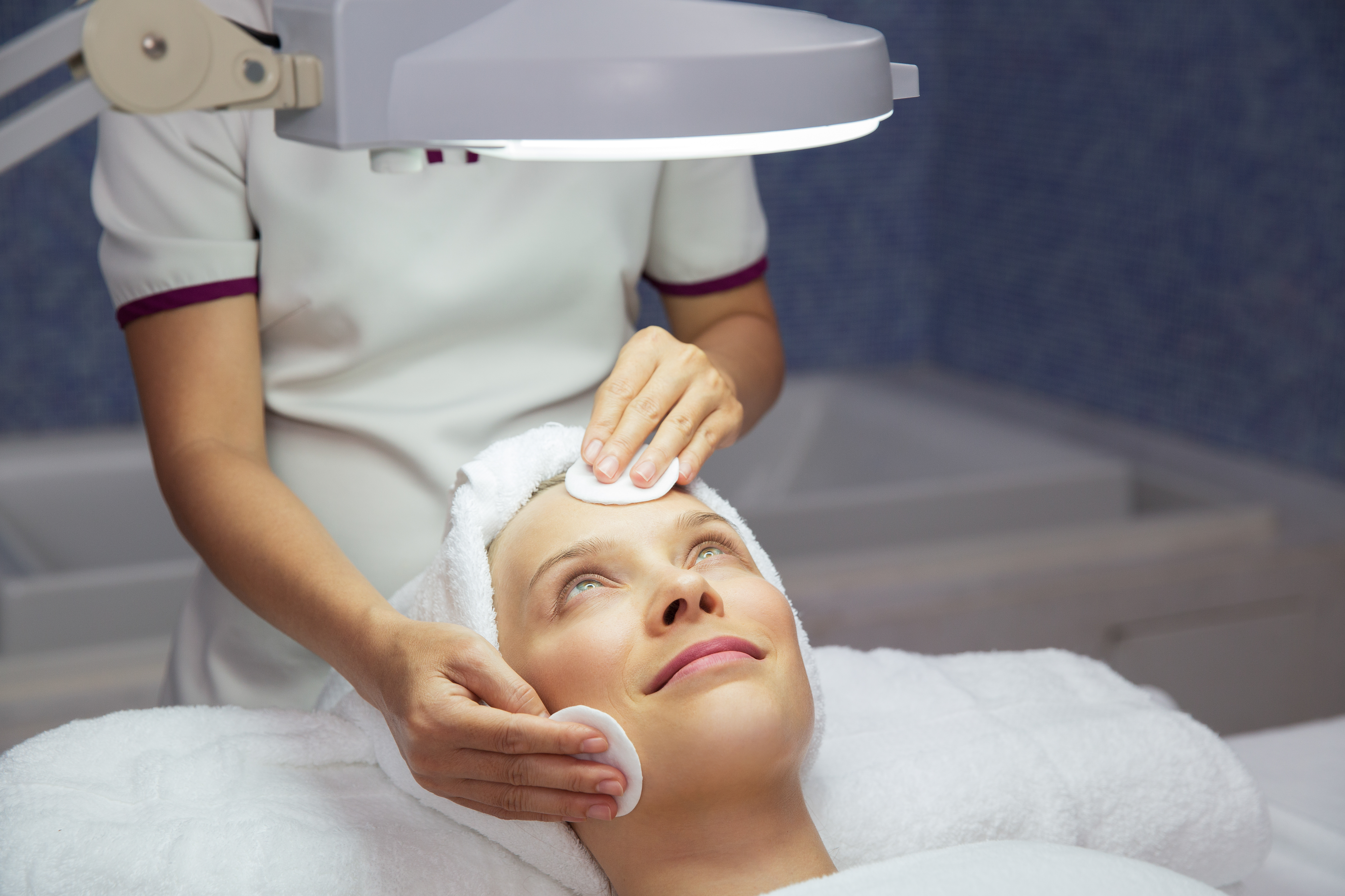 Woman Getting Facial Treatment in Beauty Salon